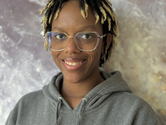 Headshot of Selena Hopkins-Morand smiling at camera