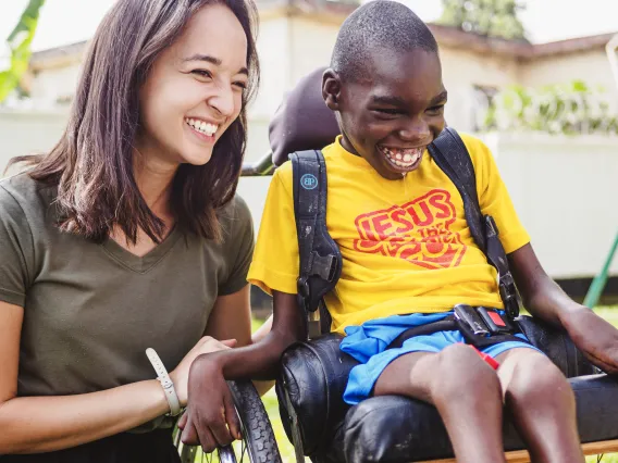 Allyson Mitchell with young child in wheelchair