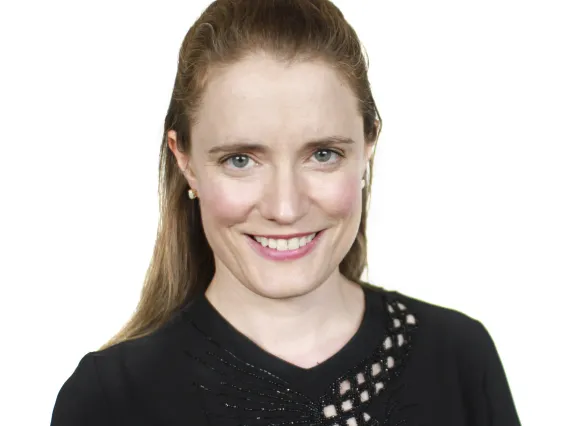 Headshot of Nora Evans-Reitz smiling