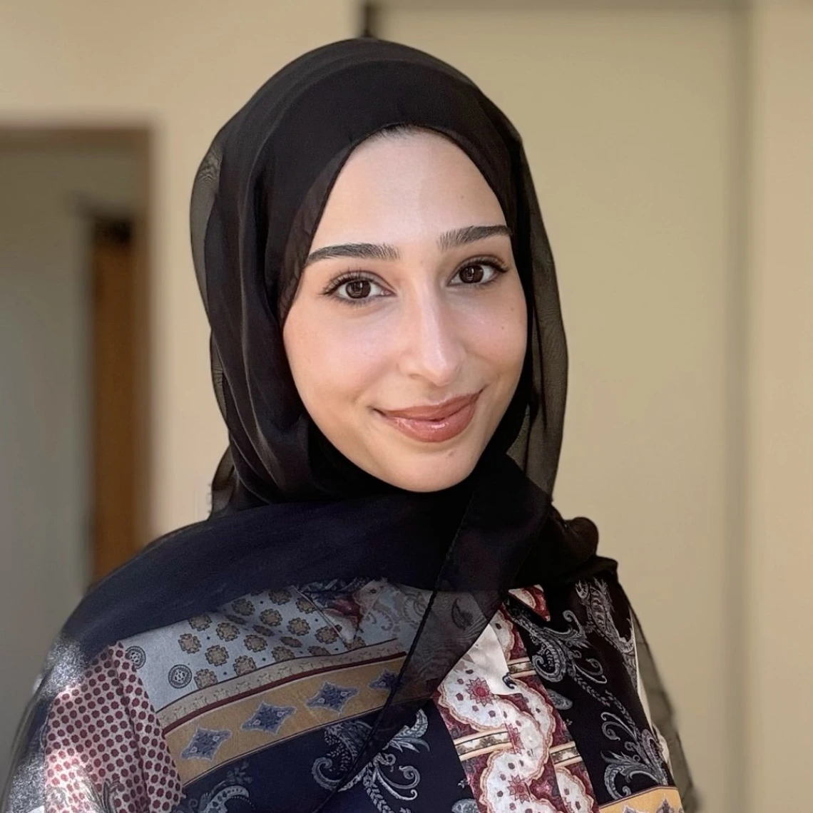 Headshot of Fatima Jebahi smiling at camera