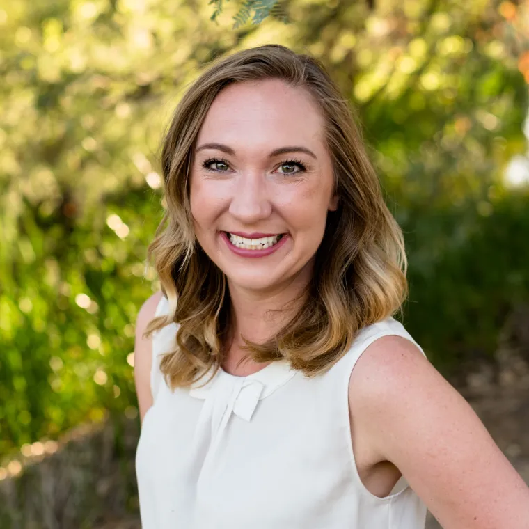 Headshot of Sarah Cretcher smiling at the camera