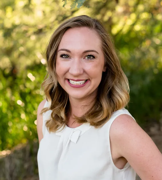 Headshot of Sarah Cretcher smiling at the camera