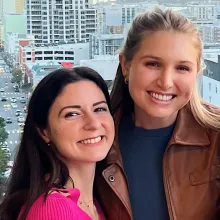 Lauren Mann and Taylor Madsen looking at the camera smiling.